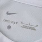 Close-up of the Corinthians 2025/26 Fan Version home jersey tag showing Nike logo and sizing details.