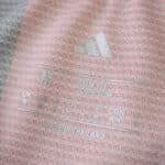 Size and label details inside Eintracht Frankfurt Home 2025/26 Fan Version jersey, showing Adidas logo.