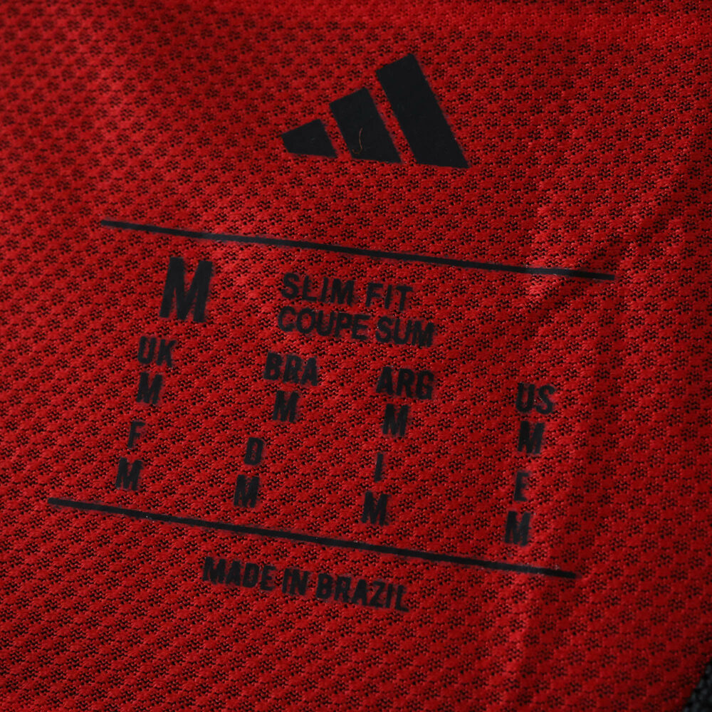 Close-up of Flamengo 2025/26 Home Player Version jersey label, showing size info and "Made in Brazil" text.