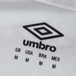 Close-up of Umbro logo and size chart printed on Fluminense Away 2025/26 Fan Version jersey fabric.