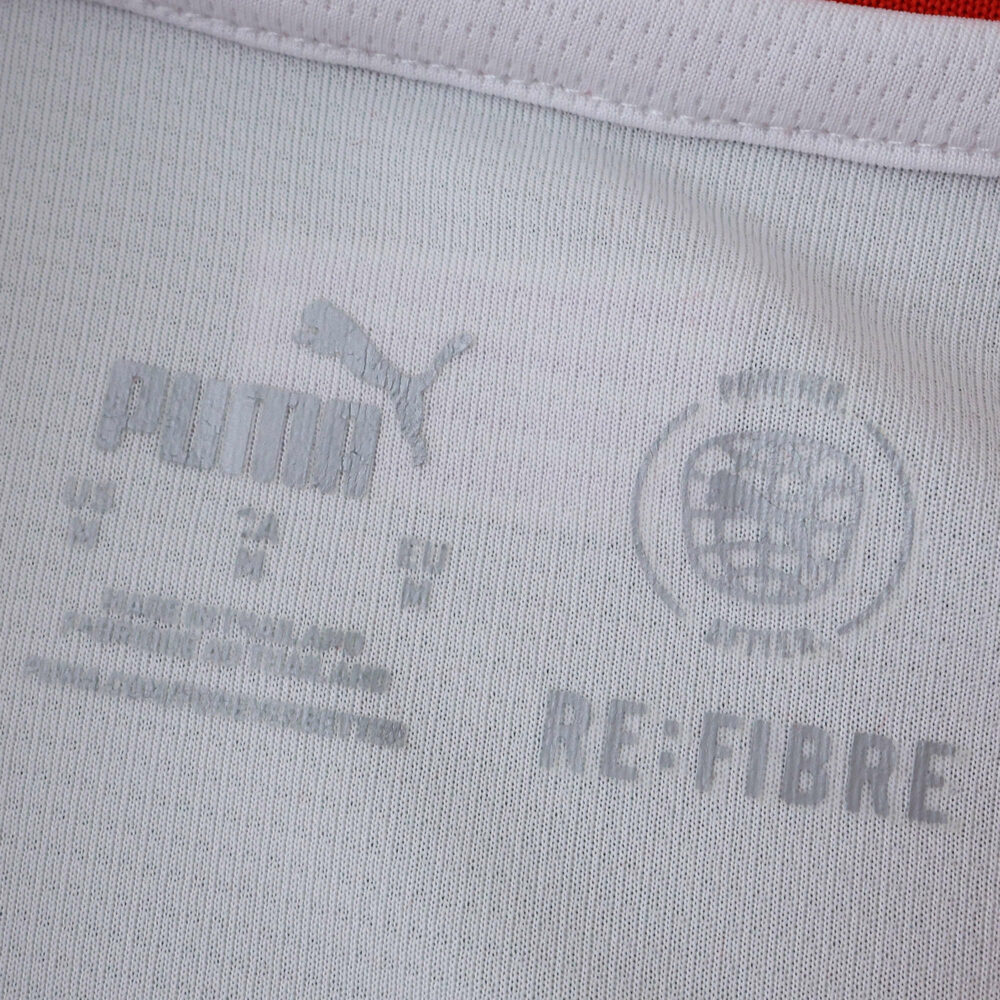Close-up of inner collar print on Girona Home 2025/26 Fan Version jersey, showing Puma and club logos.