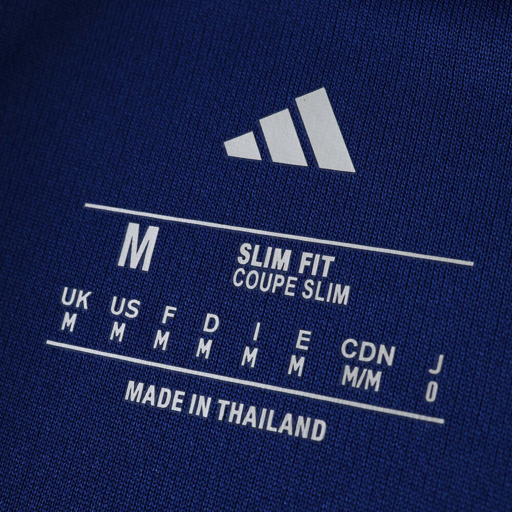Close-up of Hamburger SV Away 2025/26 Fan Version label showing size M and slim fit details.