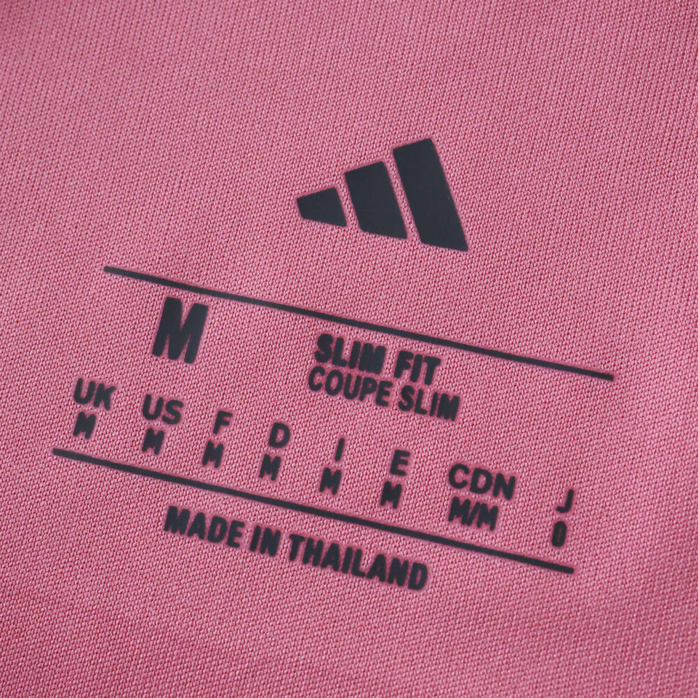 Close-up of Inter Miami CF 2025/26 Home Player Version jersey size tag showing medium, slim fit, made in Thailand.