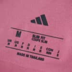 Close-up of Inter Miami CF 2025/26 Home Player Version jersey size tag showing medium, slim fit, made in Thailand.