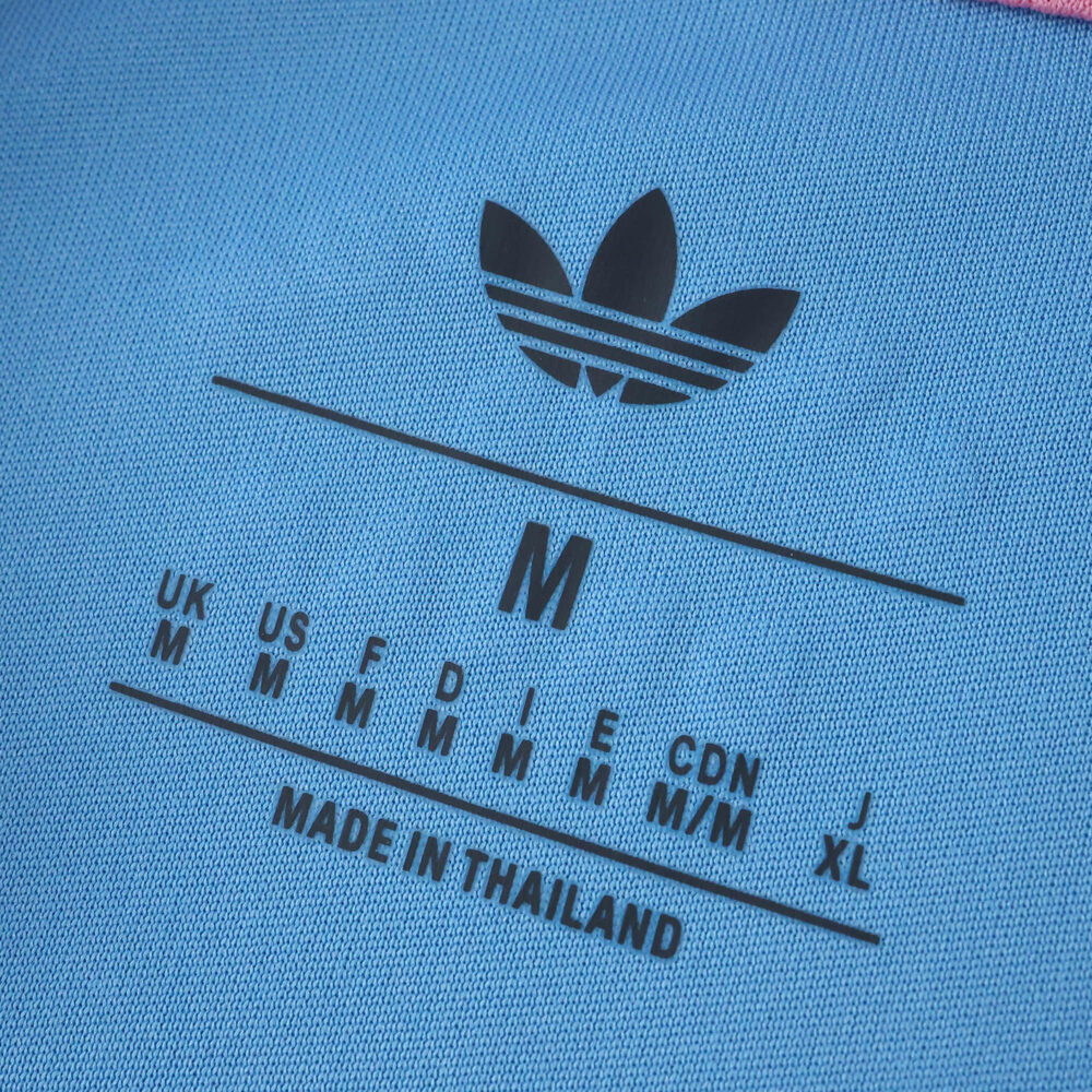 Close-up of the Inter Miami CF Third 2025/26 Fan Version collar tag showing Adidas logo and sizing info.