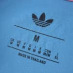 Close-up of the Inter Miami CF Third 2025/26 Fan Version collar tag showing Adidas logo and sizing info.