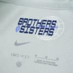 Close-up of Inter Milan Away 2025/26 Fan Version shirt tag with "Brothers & Sisters" and Nike logo.