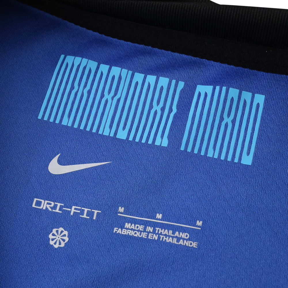 Close-up of the neck area on Inter Milan 2025/26 Home Fan jersey showing club text, Nike logo, and Dri-FIT label.