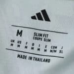 Juventus Away 2025/26 Fan Version shirt tag showing size M, slim fit, made in Thailand.