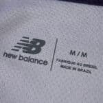 Close-up of Lille LOSC Away 2025/26 Fan Version jersey showing New Balance logo and sizing label.