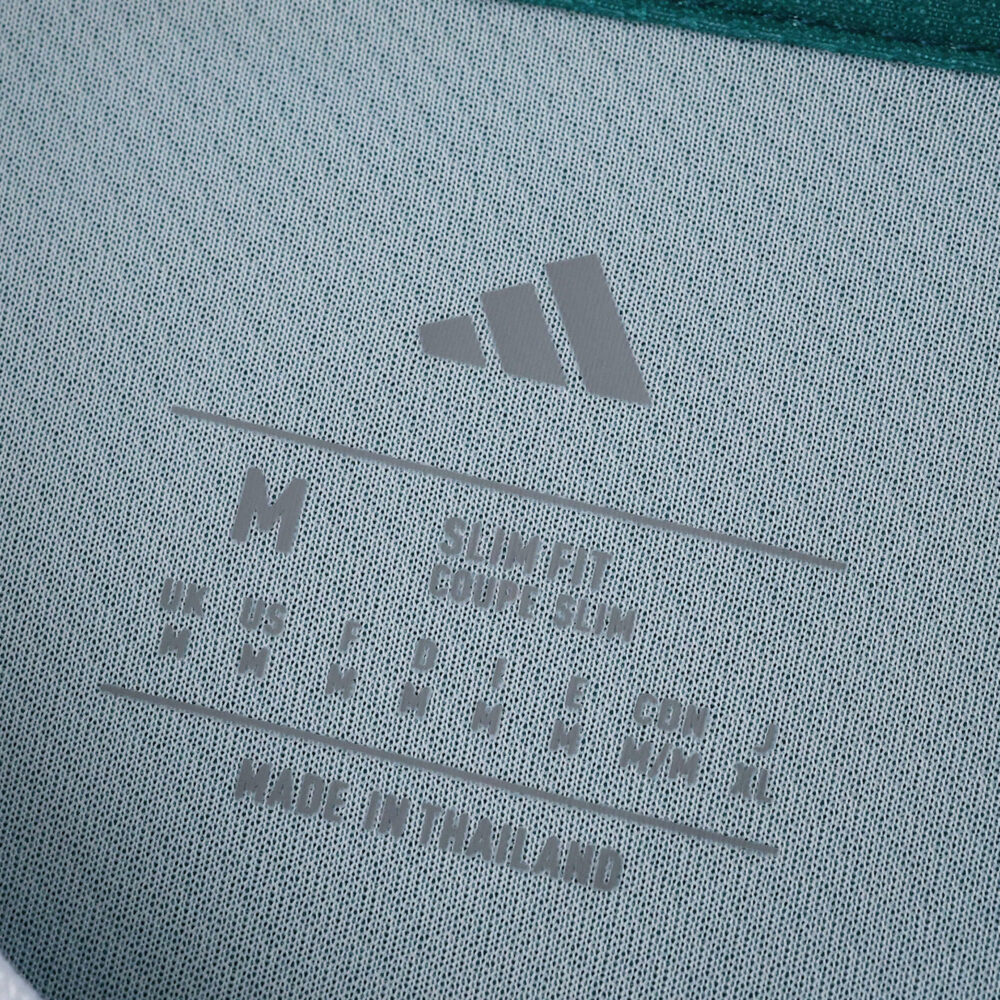 Close-up of Liverpool Third 2025/26 Fan Version jersey tag with Adidas logo, size details, and "Made in Thailand".