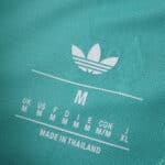 Close-up of the inside collar label on the Liverpool Third 2025/26 Player Version jersey showing size and Adidas logo.