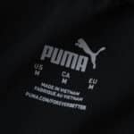 Close-up of PUMA logo and size label inside Manchester City Away 2025/26 Player Version shirt.