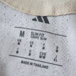 Close-up of the New York Red Bulls Away 2025/26 Player Version jersey size tag, showing "Slim Fit."