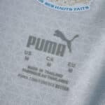 Close-up of PUMA sizing and care label inside the Olympique Marseille 2025/26 Home Player Version jersey.