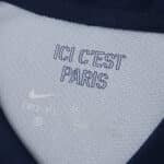 Close-up of Paris Saint-Germain 2025/26 home jersey collar with "ICI C'EST PARIS" text and Nike logo.