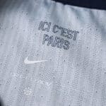 Close-up of the inside collar of the PSG 2025/26 home player jersey showing "ICI C'EST PARIS" text and Nike logo.