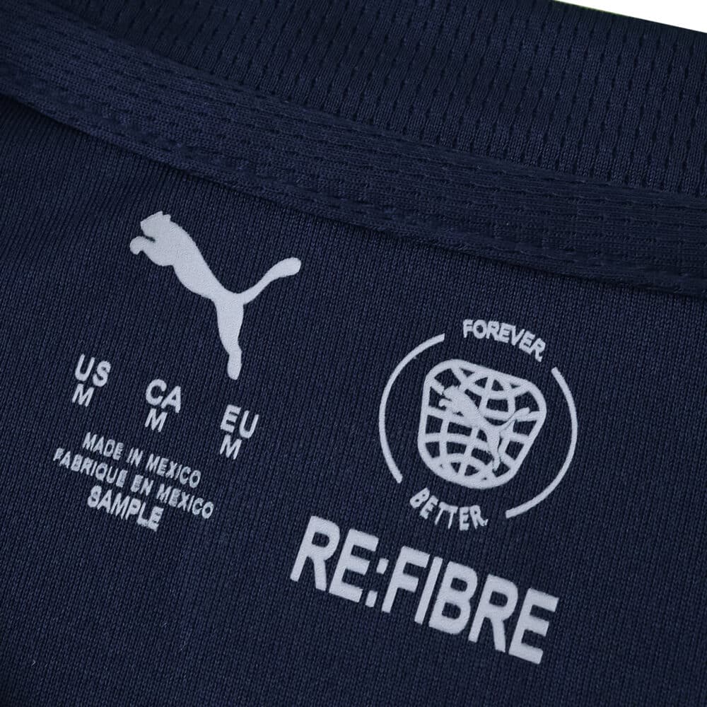 Close-up of the PSV Eindhoven Away 2025/26 Fan Version collar with Puma and RE:FIBRE logos.