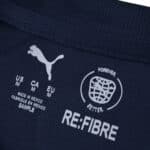 Close-up of the PSV Eindhoven Away 2025/26 Fan Version collar with Puma and RE:FIBRE logos.