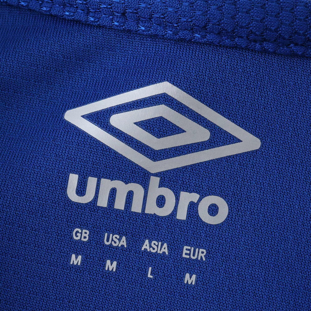 Close-up of the Umbro logo and size chart on the blue Rangers Home 2025/26 Fan Version jersey.