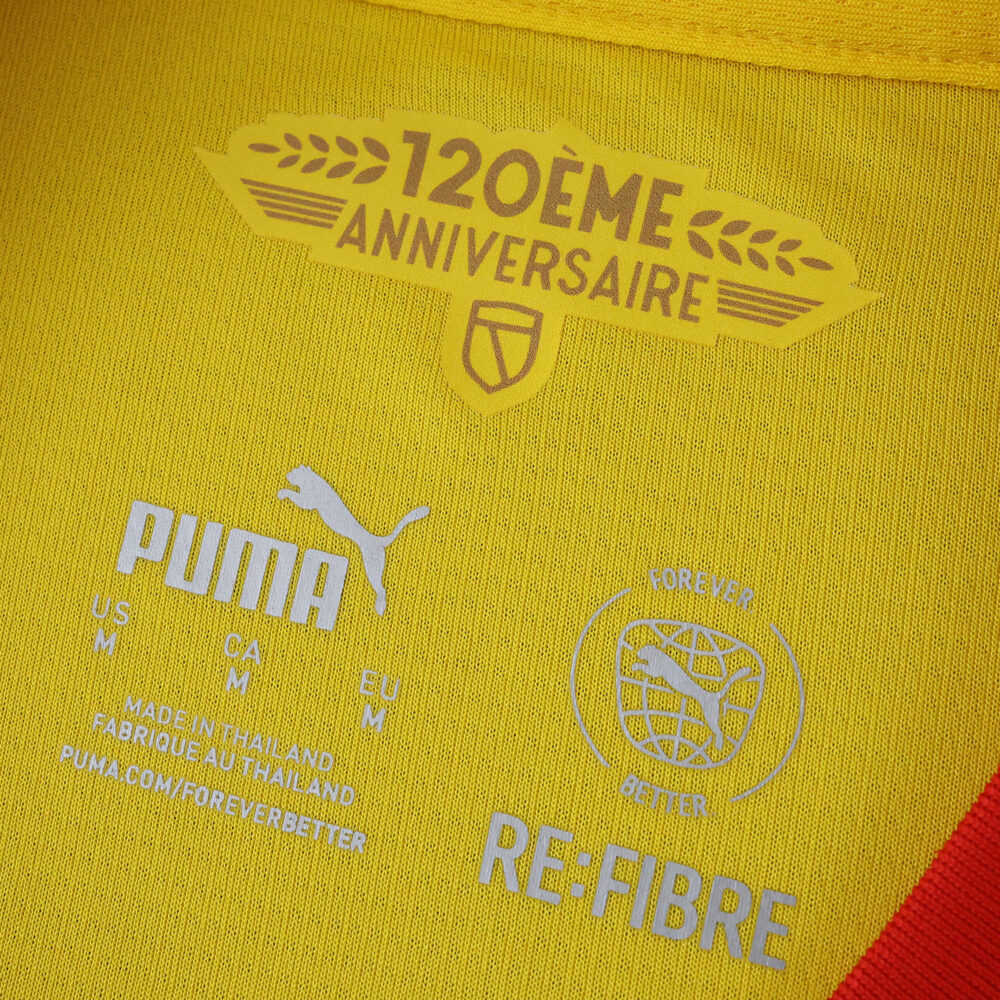 Close-up of the RC Lens 2025/26 home jersey collar, featuring "120ème Anniversaire" and Puma branding.