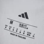 Close-up of the neck label on the 2025/26 Real Madrid Home Fan Version, showing size and fit details.