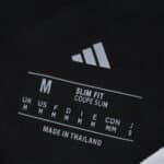 Close-up of the inner neck label on the River Plate Away 2025/26 Fan Version, showing size and fit details.