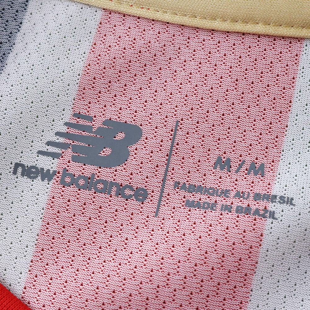 Close-up of São Paulo Away 2025/26 Fan Version jersey collar with New Balance logo and size label.
