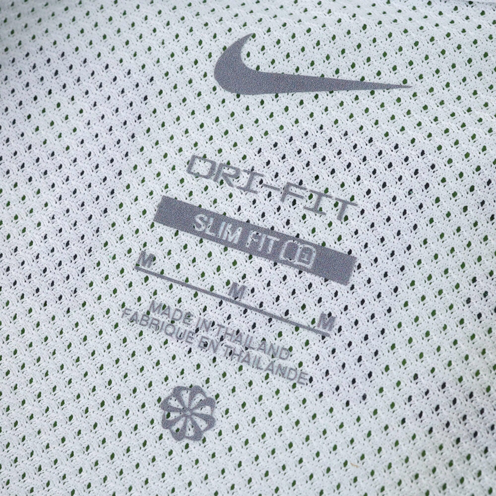 Close-up of inner label on Sporting CP 2025/26 home fan jersey, showing Nike logo and product details.