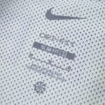 Close-up of inner label on Sporting CP 2025/26 home fan jersey, showing Nike logo and product details.