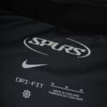 Close-up of Tottenham Hotspur Away 2025/26 Fan Version shirt with Spurs, Nike, and Dri-FIT logos.