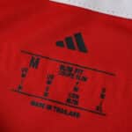 Close-up of the Union Berlin 2025/26 Home Fan Version shirt tag showing size and fit information.