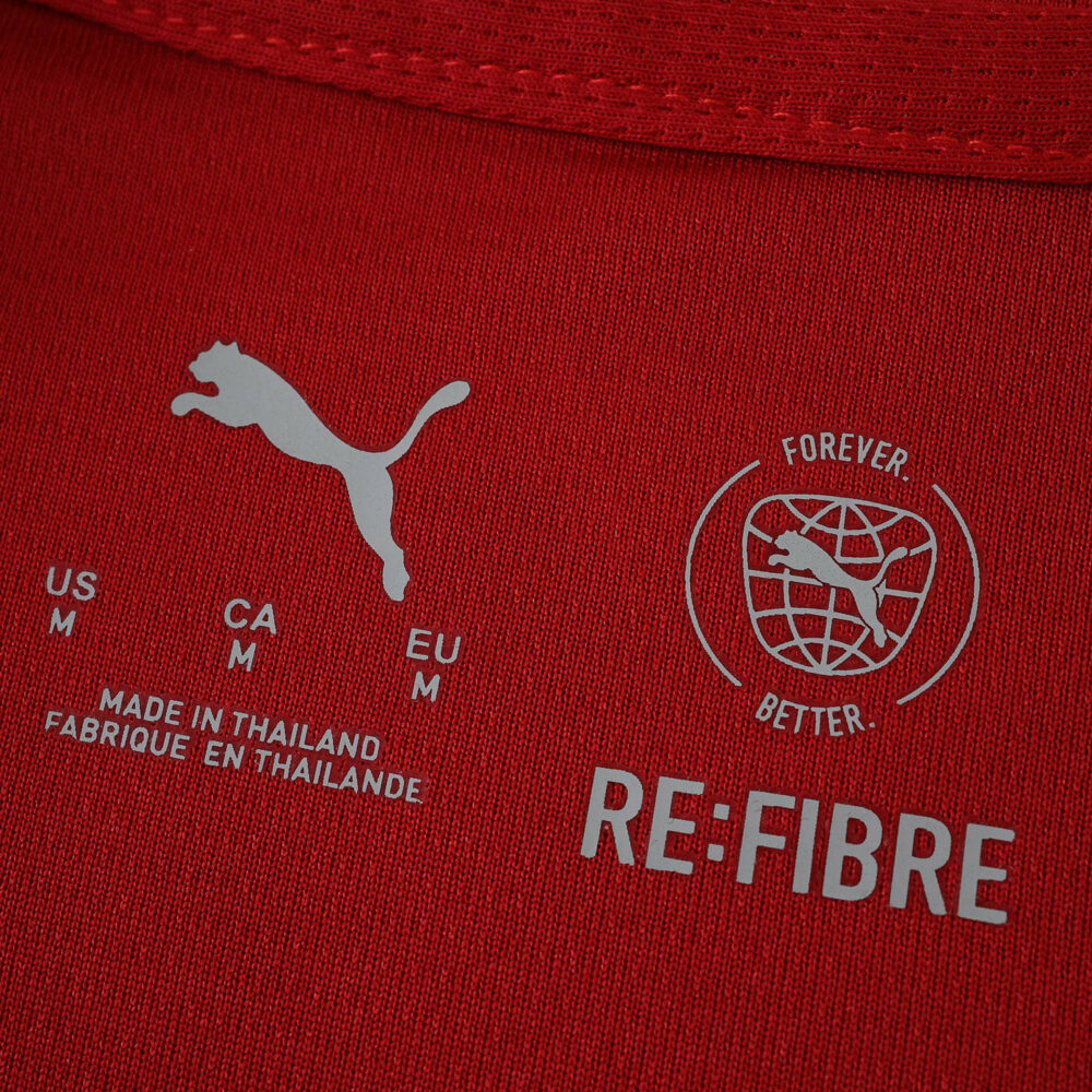 Close-up of the inside label on the Valencia Away 2025/26 Fan Version shirt showing Puma branding and RE:FIBRE logo.