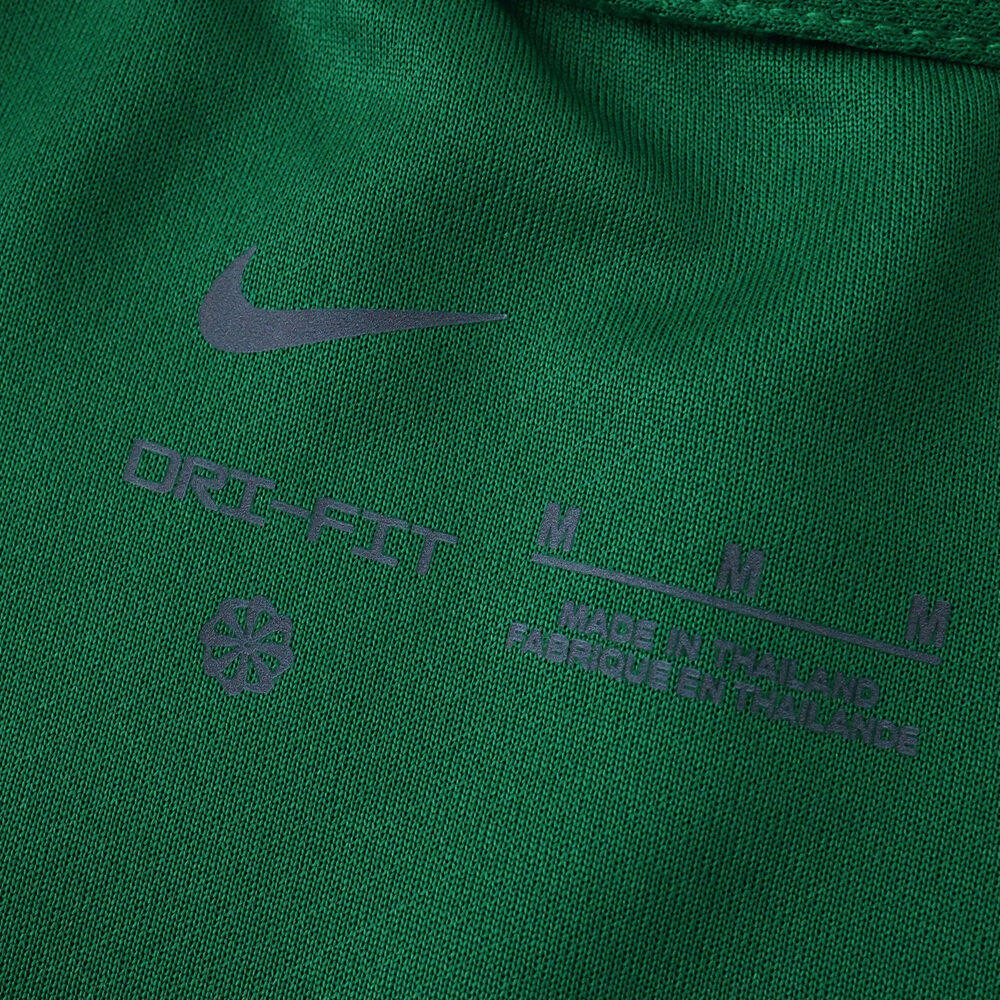 Close-up of the VfL Wolfsburg 2025/26 home fan jersey collar with Nike logo and product details.