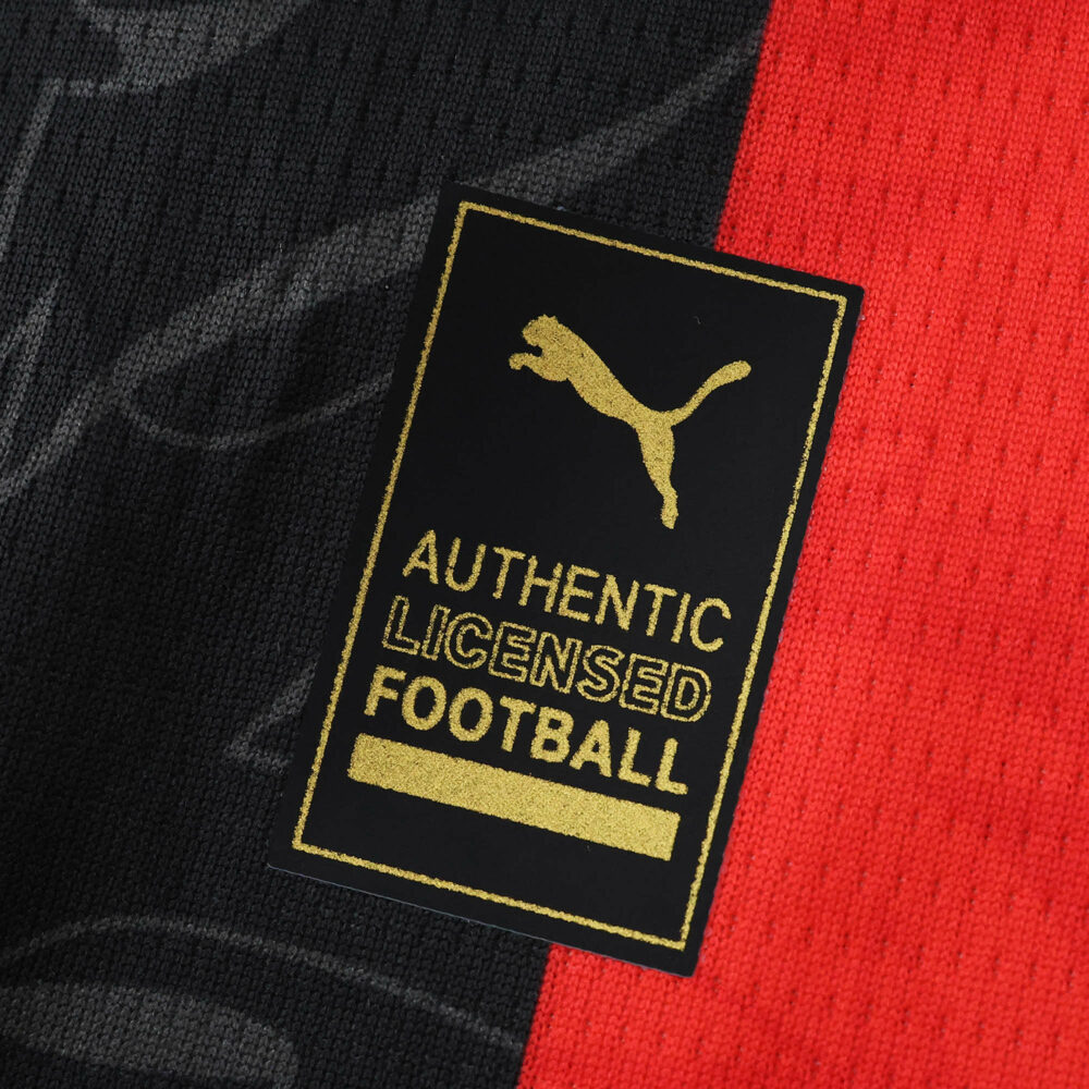 Close-up of Puma Authentic Licensed Football badge on AC Milan 2025/26 Home Fan Version jersey.