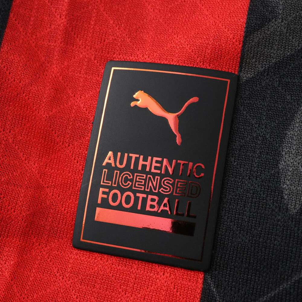 Close-up of the Puma Authentic Licensed Football badge on the AC Milan 2025/26 Home Player Version jersey.