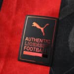 Close-up of the Puma Authentic Licensed Football badge on the AC Milan 2025/26 Home Player Version jersey.