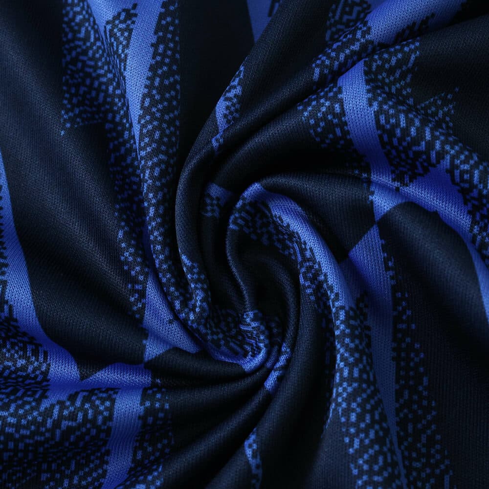 Close-up of Arsenal Away 2025/26 Fan Version jersey fabric with blue and black pattern.