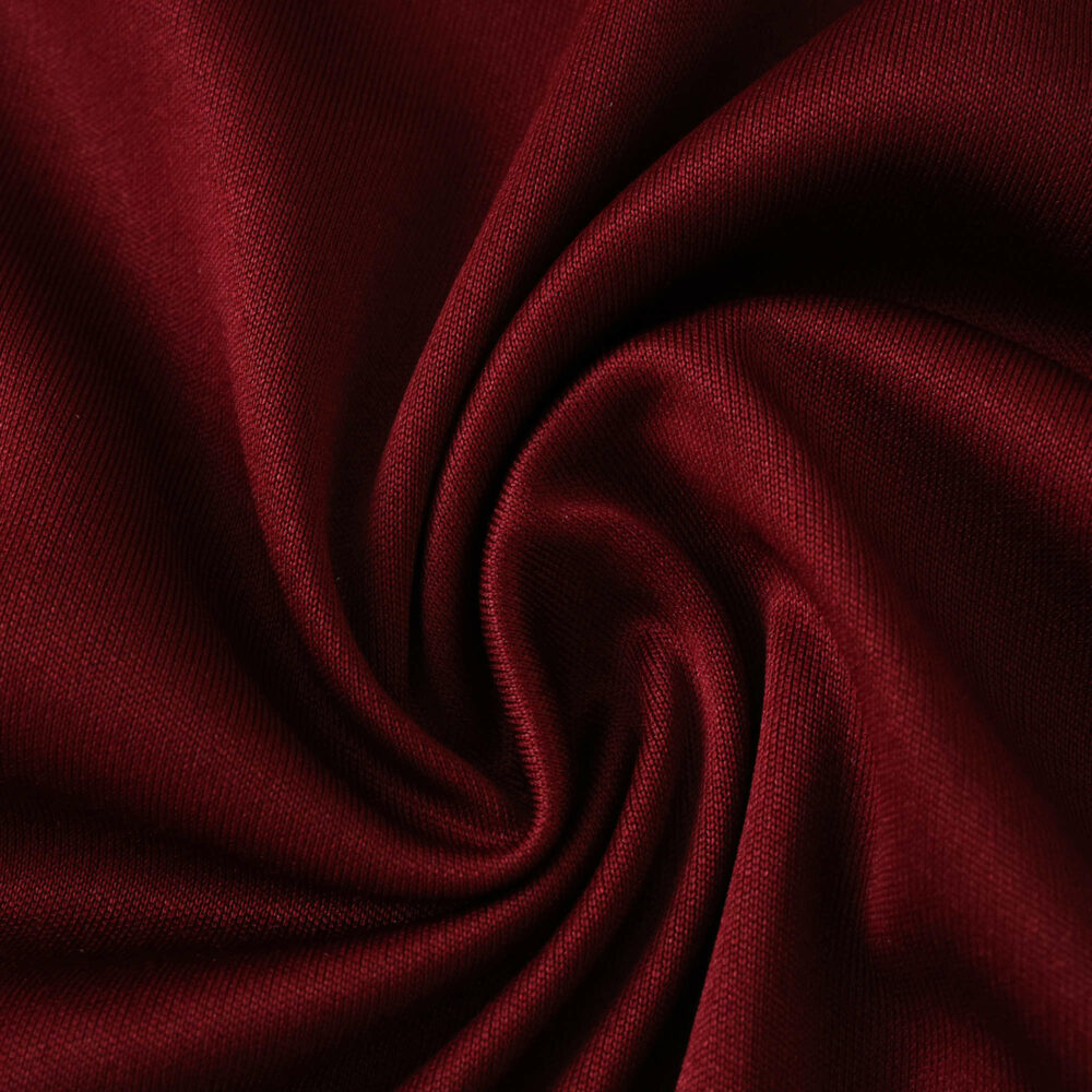 Close-up of claret fabric used for Aston Villa Home 2025/26 Fan Version jersey, showing texture and color.