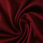 Close-up of claret fabric used for Aston Villa Home 2025/26 Fan Version jersey, showing texture and color.