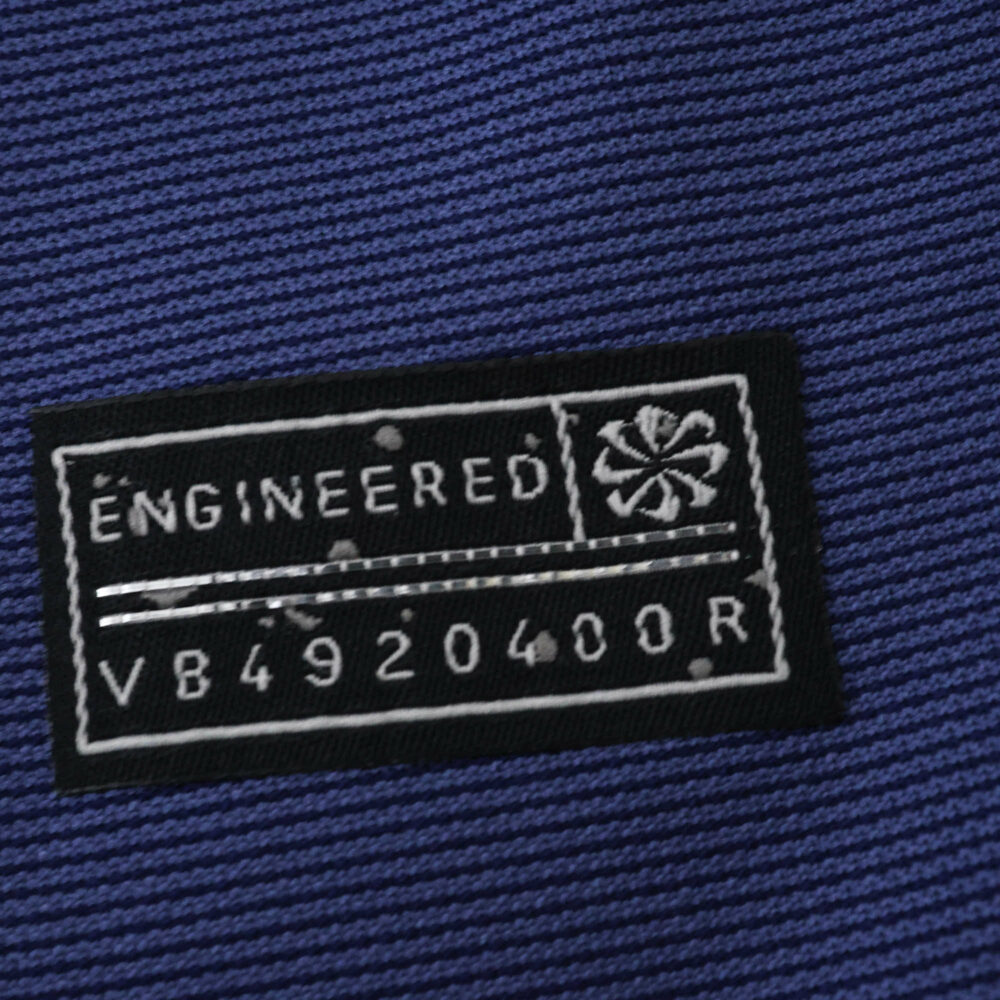Close-up of the "Engineered" authenticity patch on the Atlético Madrid Away 2025/26 Fan Version jersey.