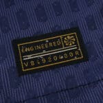 Close-up of the engineered authenticity tag on Atlético Madrid Away 2025/26 Player Version jersey.