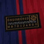 Close-up of the engineered authenticity patch on the 2025/26 Barcelona Home Player Version jersey.