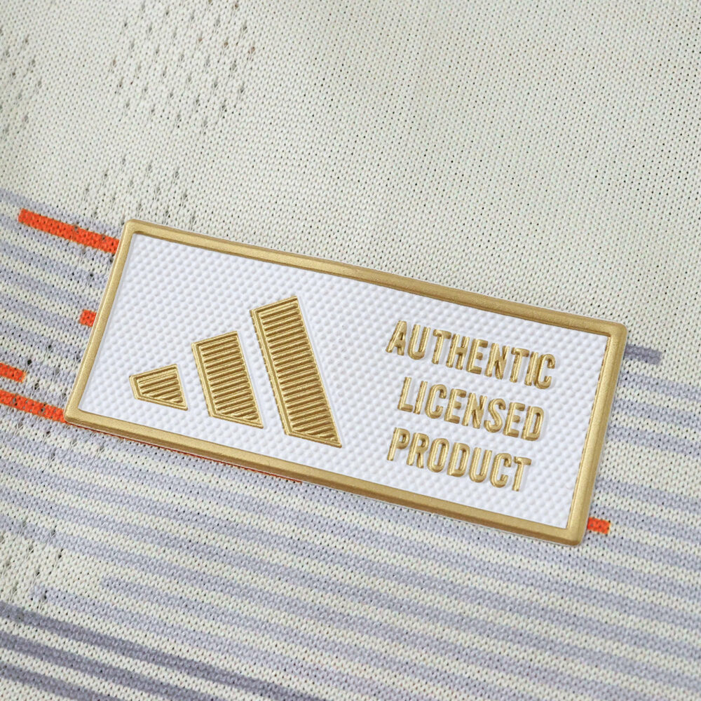 Close-up of the gold Authentic Licensed Product badge on the Bayern Munich 2025/26 Away Player Version jersey.