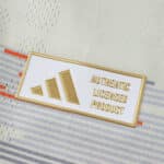 Close-up of the gold Authentic Licensed Product badge on the Bayern Munich 2025/26 Away Player Version jersey.