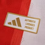 Close-up of the "Authentic Licensed Product" badge on the Bayern Munich Home 2025/26 Player Version jersey.