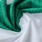 Close-up of Celtic Home 2025/26 fan version jersey fabric with green and white stripes.