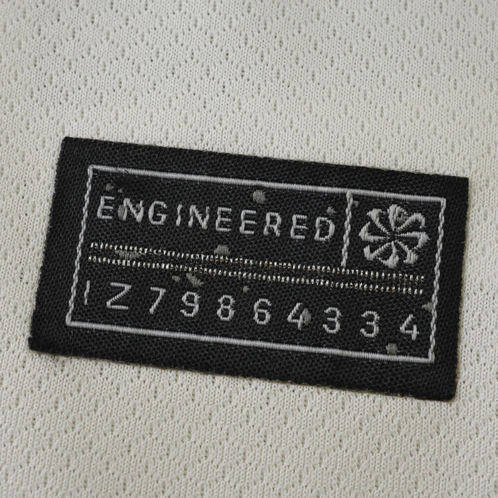 Close-up of the "Engineered" authenticity tag on the Chelsea Away 2025/26 Fan Version jersey.