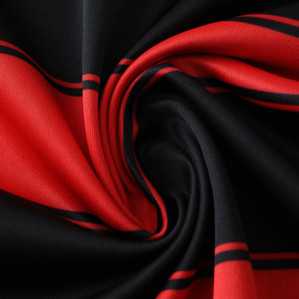 Close-up of Flamengo Home 2025/26 Fan Version jersey fabric showing red and black stripes.