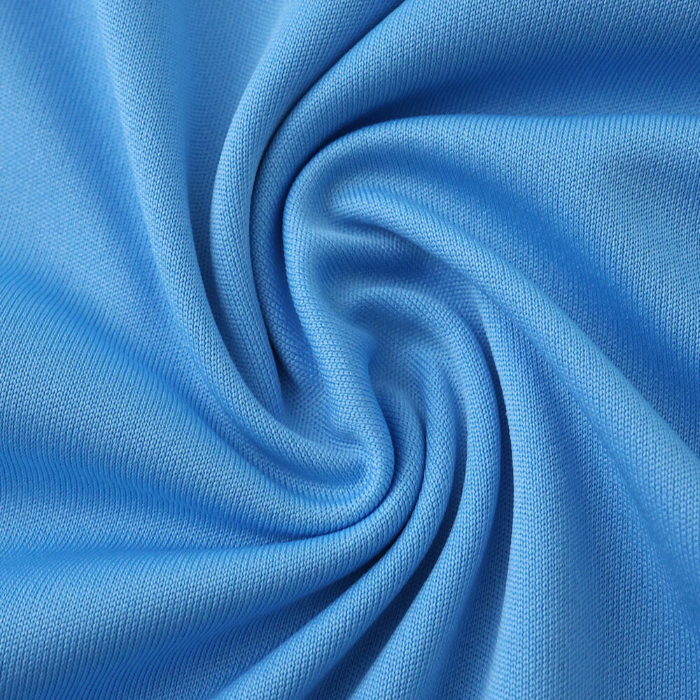 Close-up of light blue Inter Miami CF Third 2025/26 Fan Version jersey fabric with visible texture.